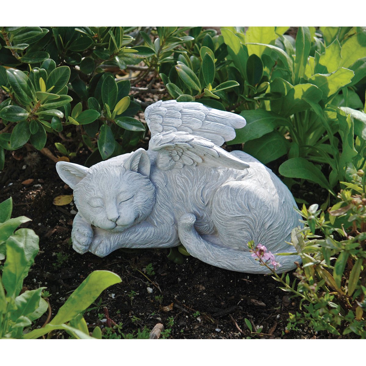 Garden display of Design Toscano QL6080 memorial statue for outdoor tribute.
