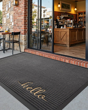 DEXI dirt-scraping mat captures debris from shoes at the doorstep.