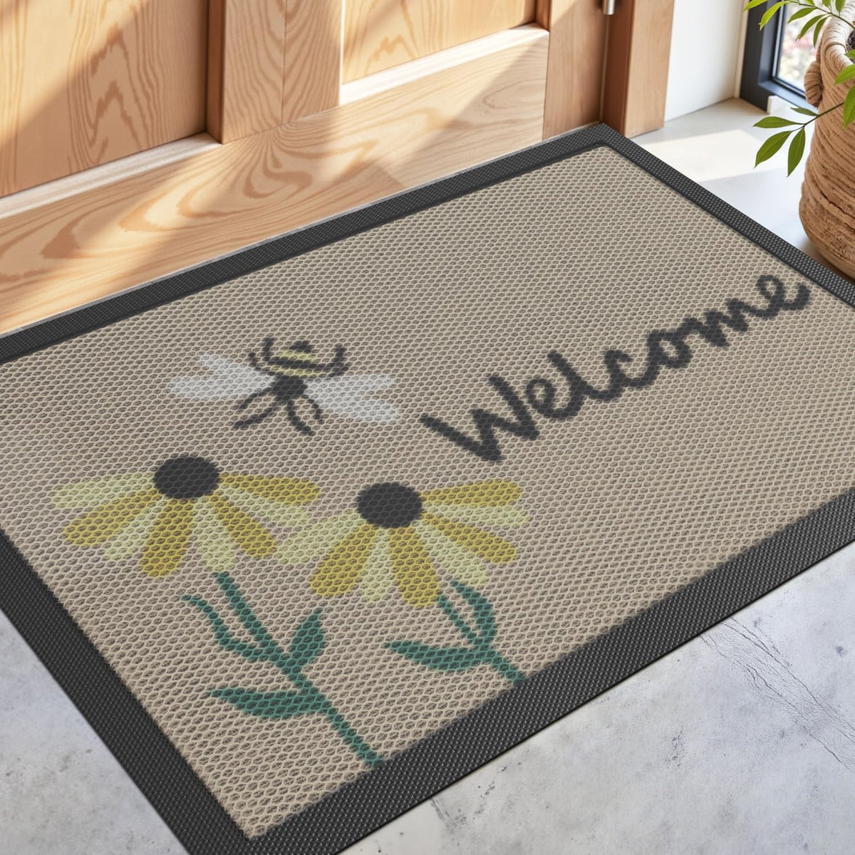 DEXI Front Door Mat with bee and flower design traps dirt outside.