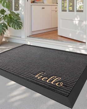 DEXI front door mat outside entrance in Hello Grey showing moisture trapping action