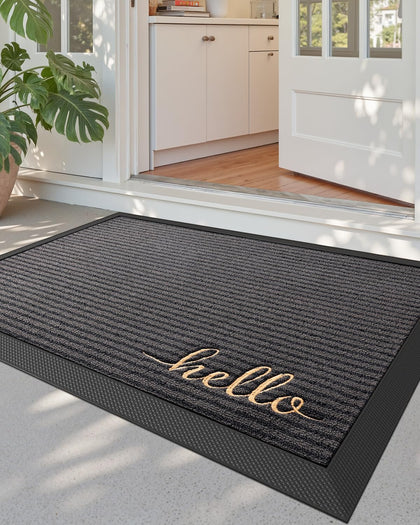 DEXI front door mat outside entrance in Hello Grey showing moisture trapping action