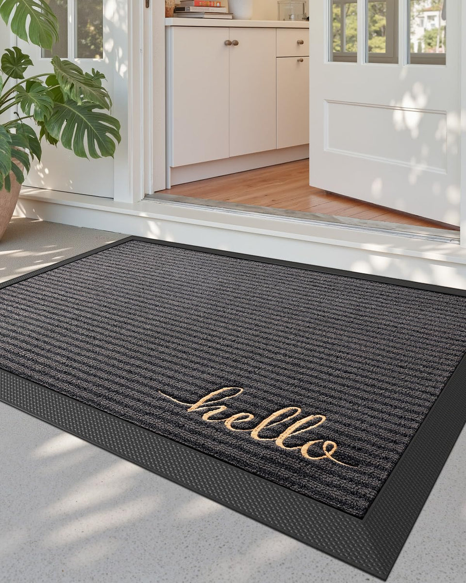 DEXI front door mat outside entrance in Hello Grey showing moisture trapping action