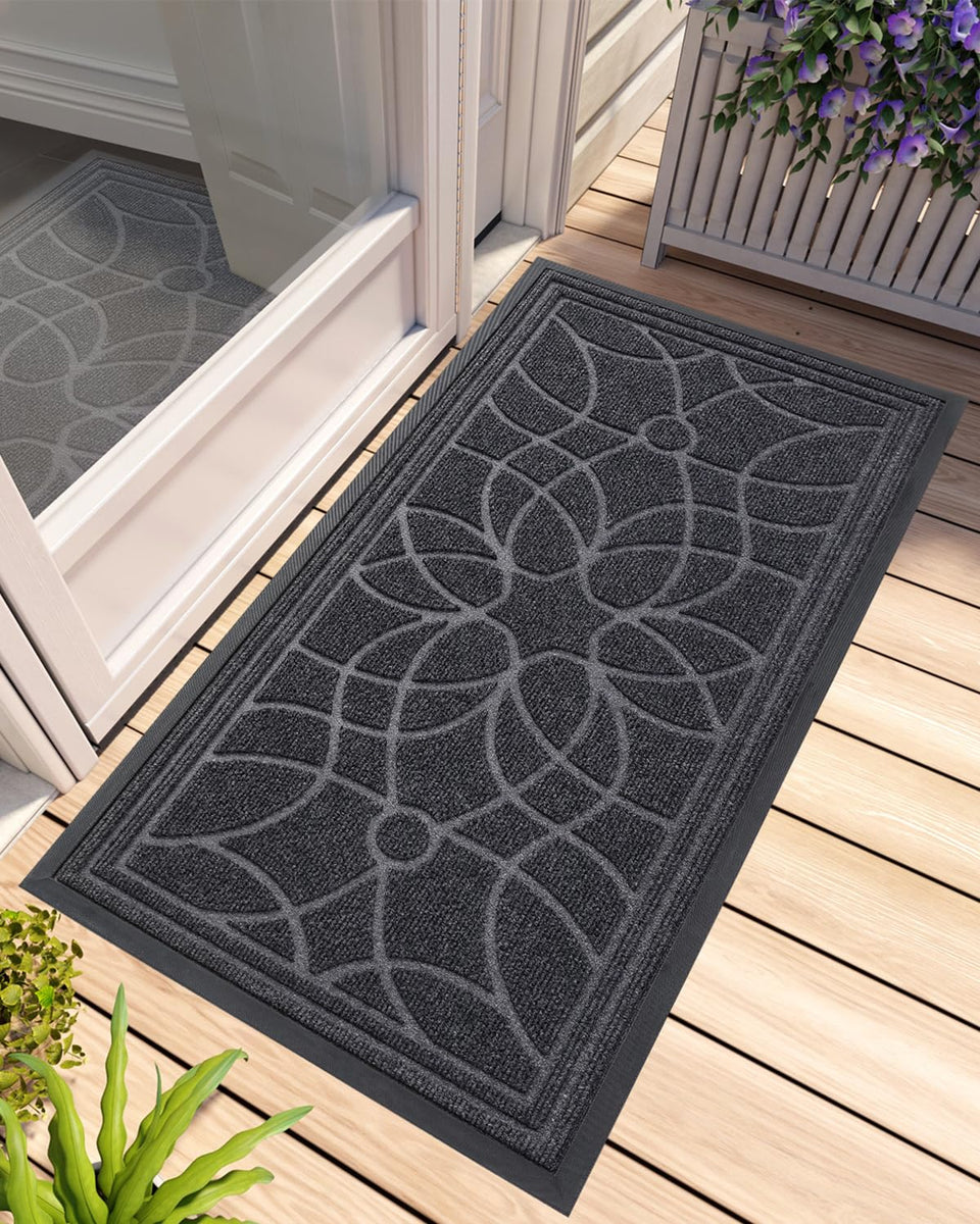 DEXI front door mat at outside entrance with durable, weather-ready construction.