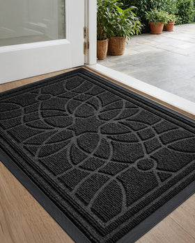 DEXI front door mat with patterned grooves captures dirt for a cleaner entry.