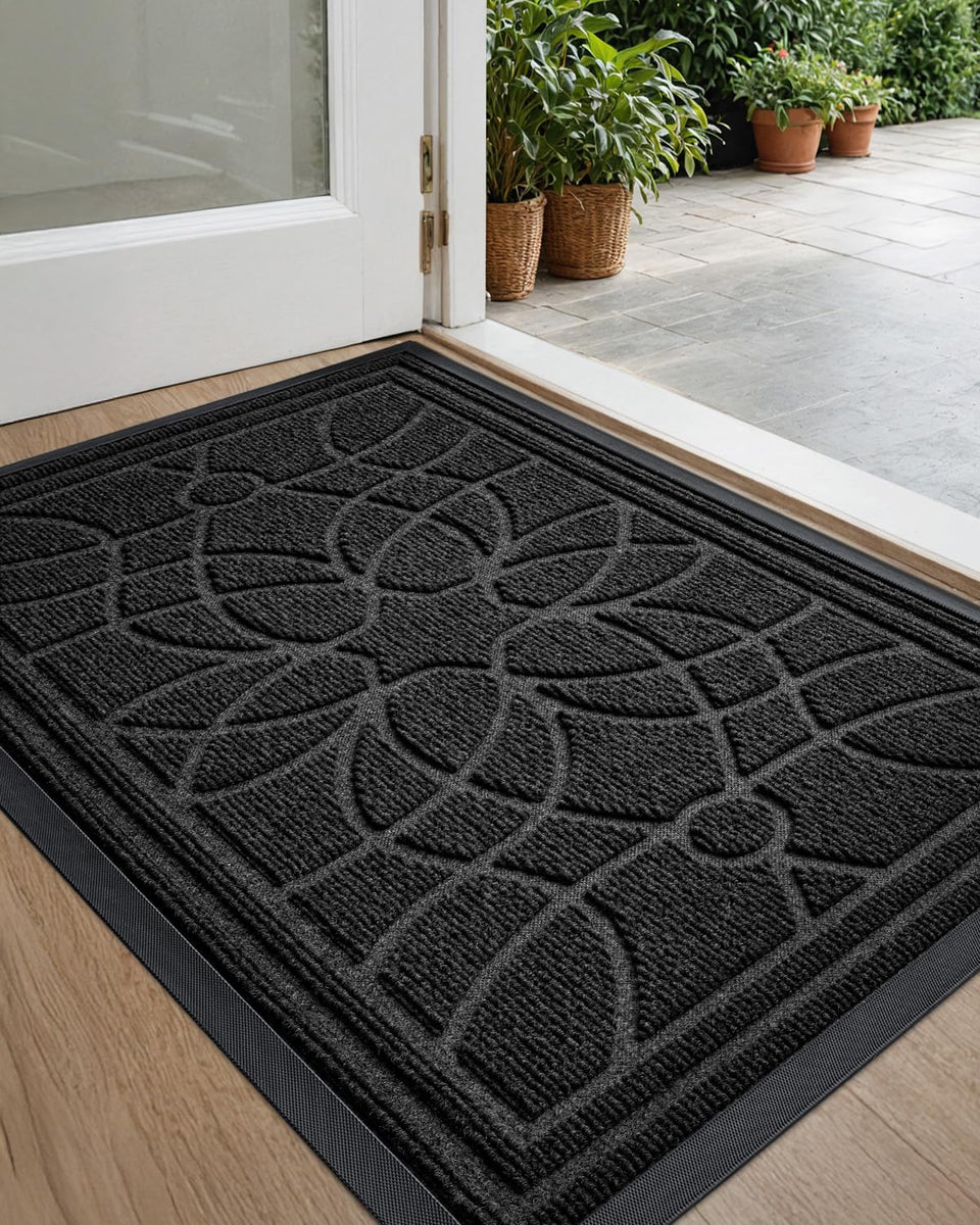 DEXI front door mat with patterned grooves captures dirt for a cleaner entry.