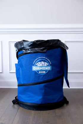 Diamond Shine bag filled with branches and leaves for disposal.