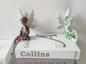 Dianreno white-winged fairy figurine offers a refined, clean aesthetic.