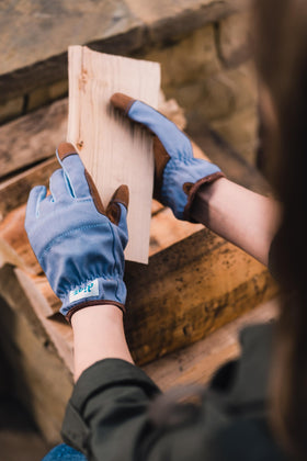 DIGZ gloves with knuckle padding protecting hands during tasks.