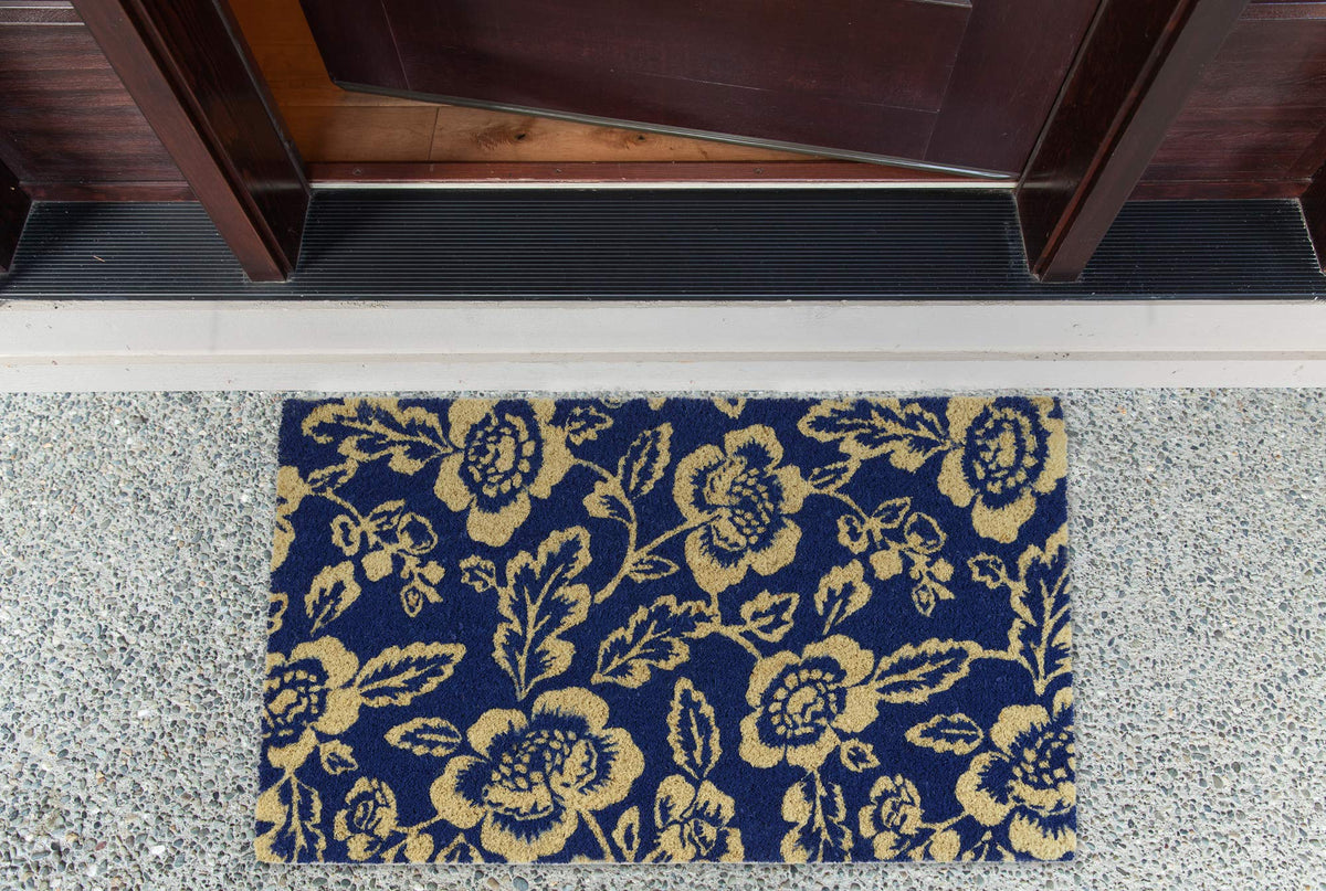 DII blue peonies doormat uses natural coconut fibers to trap dirt.