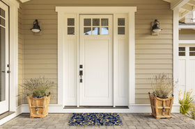 DII floral design coir doormat suited for outdoor-indoor transitions.