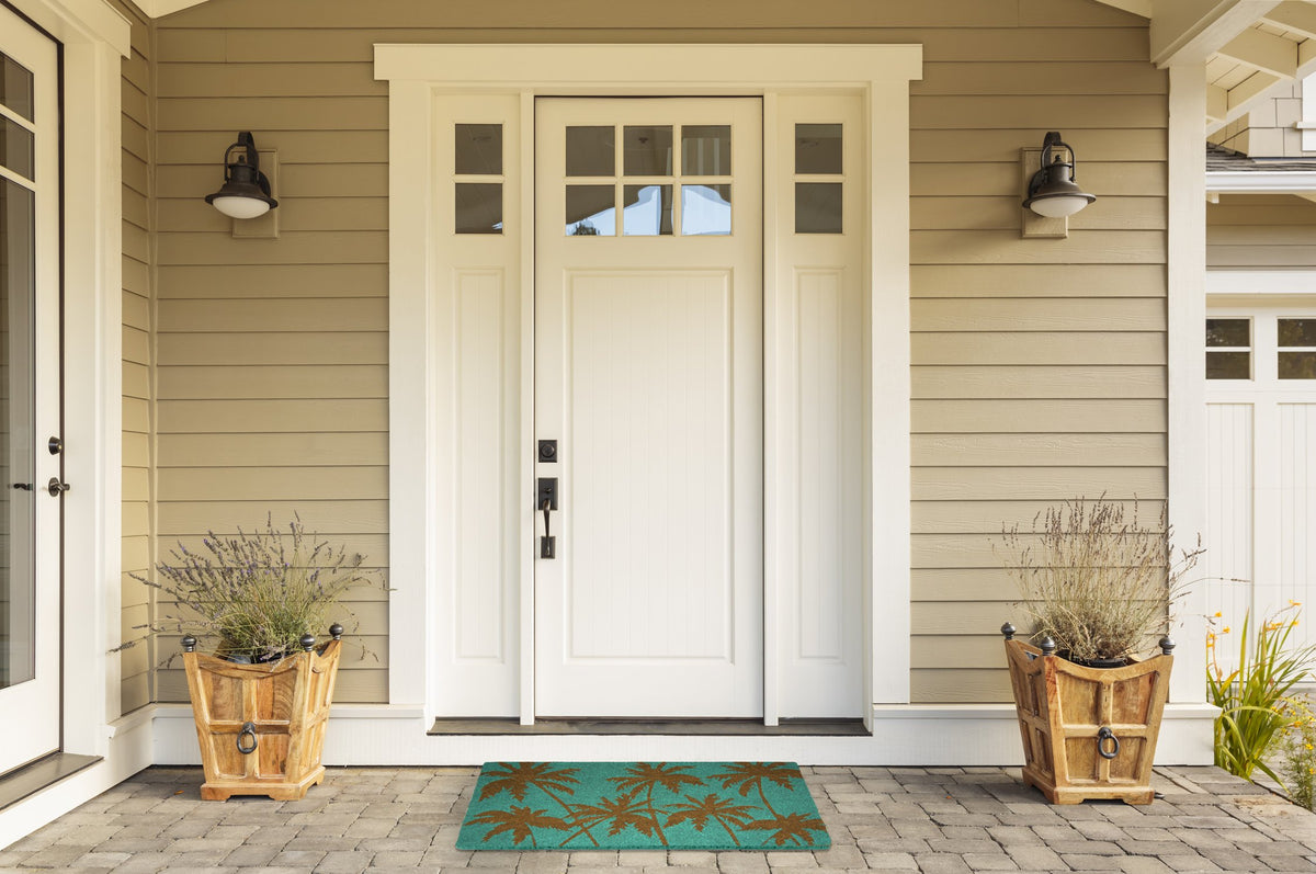DII Palm Beach mat at entryway adds coastal charm and practicality