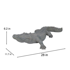 DiliComing alligator statue stalking pose adds dramatic wildlife detail to garden.
