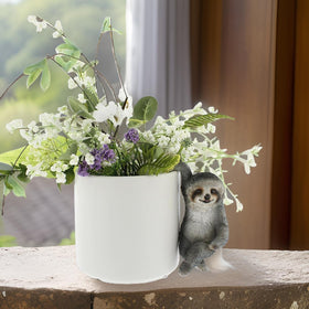 Distinctive Designs sloth plant holder enhances balconies with playful, nature-inspired decor