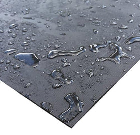 DiversiTech Ultra Grill Mat under a charcoal grill shielding concrete and stone