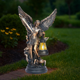 Dlfghos St Michael Archangel solar statue glowing in the front yard at night