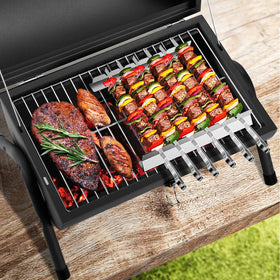 DNKMOR charcoal grill interior highlights even heat with a sturdy cooking grid.