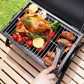 DNKMOR wooden handles stay cool while carrying the compact grill.