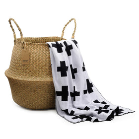 DOKOT seagrass basket positioned in a laundry or utility space