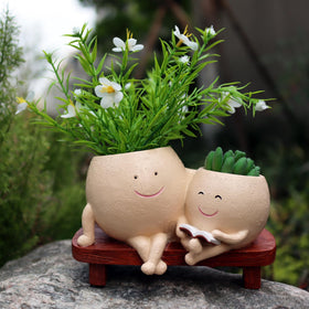 Dolkgy Face Pots desk plant brings cheer to a workspace.