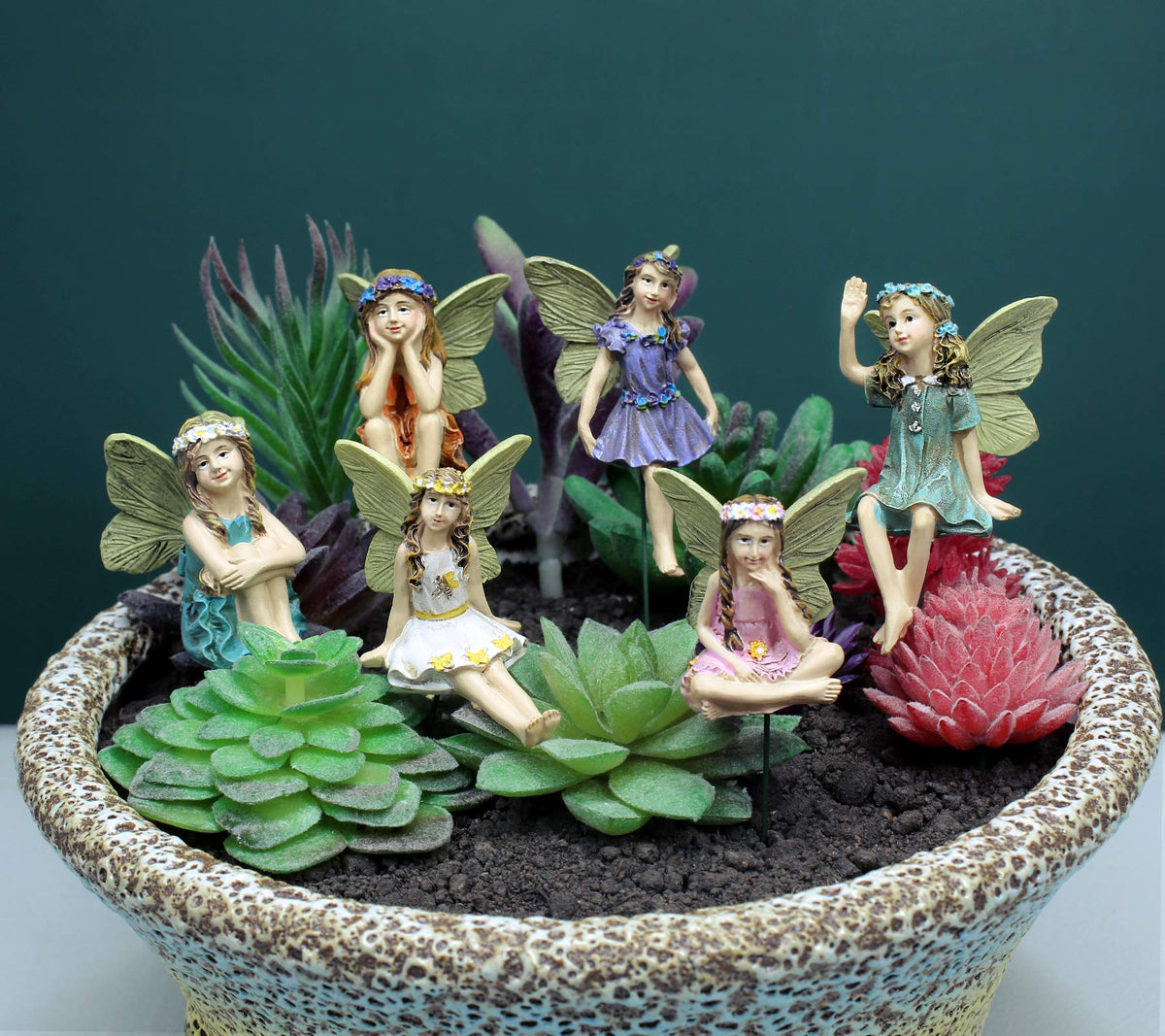 Dorlotou fairy-dance figurine brightens the garden with cheerful presence.