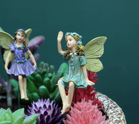 Dorlotou floral-accent fairy boosts yard appeal and personality.