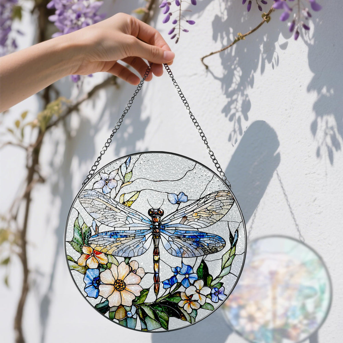 Douhasu suncatcher hanging in a window creates a colorful glow