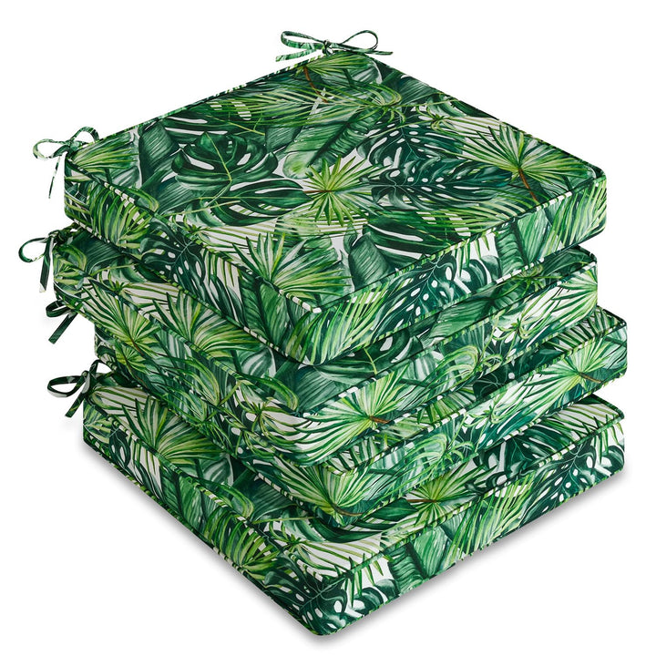 Downluxe four-pack outdoor chair cushions on patio with waterproof fabric for all-weather use.