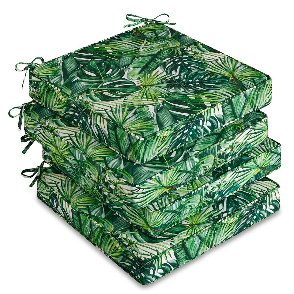 Downluxe four-pack outdoor chair cushions on patio with waterproof fabric for all-weather use.