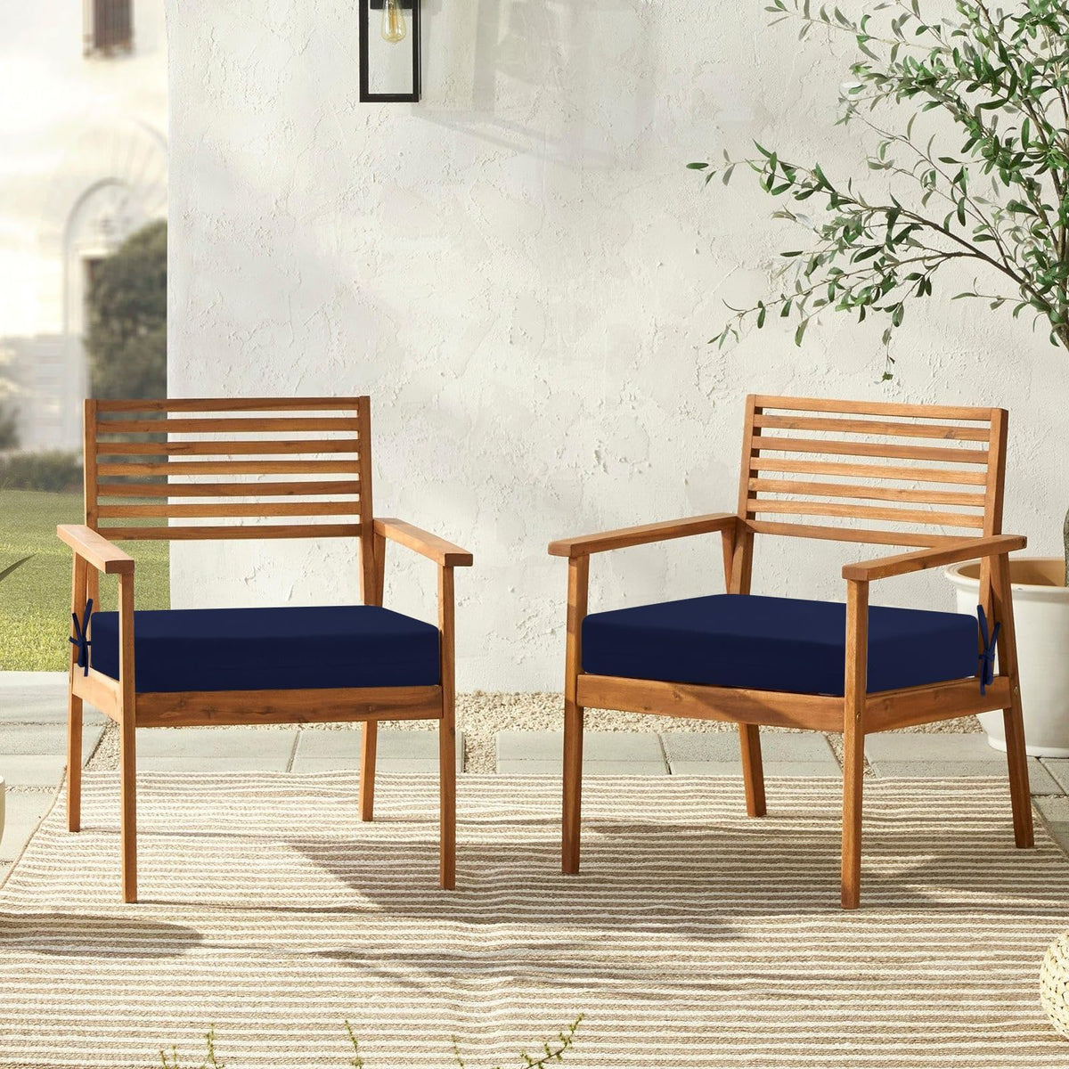 Downluxe navy cushions on a patio chair highlighting versatile outdoor use
