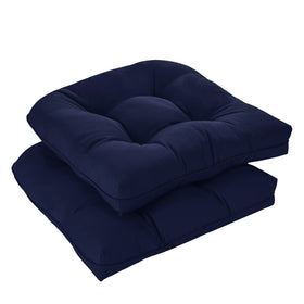 Downluxe navy tufted outdoor chair cushions add plush comfort to patio seating.