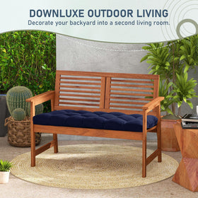 Downluxe weather-ready navy cushion invites relaxation on decks, patios, or sunrooms.