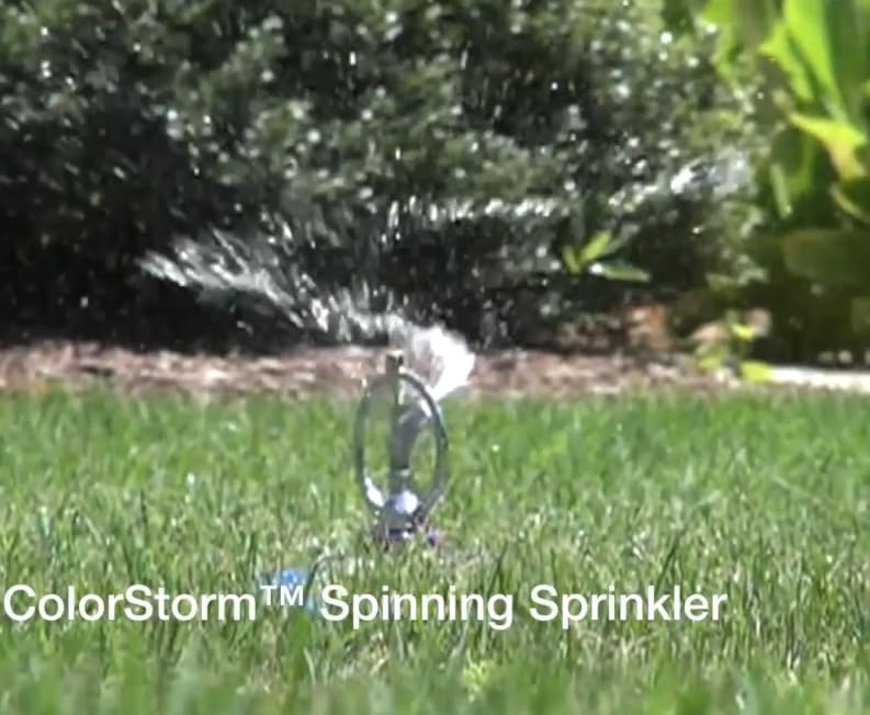 Dramm ColorStorm green sprinkler rests on a heavy base for stable watering.