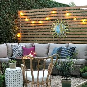 Dreamskip waterproof sun moon wall art withstands outdoor weather.