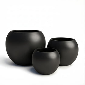 DTY planter on patio with olive tree, weather-resistant finish for lasting color.