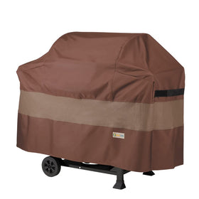 Duck Covers Ultimate Waterproof BBQ Grill Cover 65-inch on patio protects from rain and sun