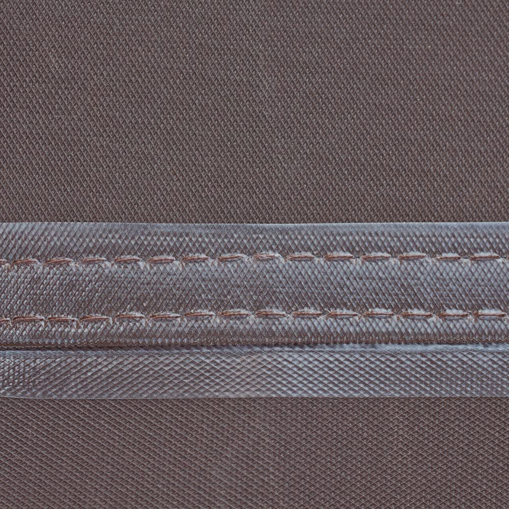 Duck Covers chaise lounge cover side view guards furniture from wind and debris.