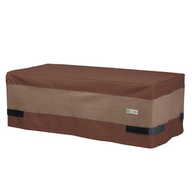 Duck Covers ultimate waterproof coffee table cover protecting a rectangular table outdoors.