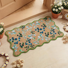 Dunzy eucalyptus leaves doormat with green scalloped edge welcomes guests and protects floors.