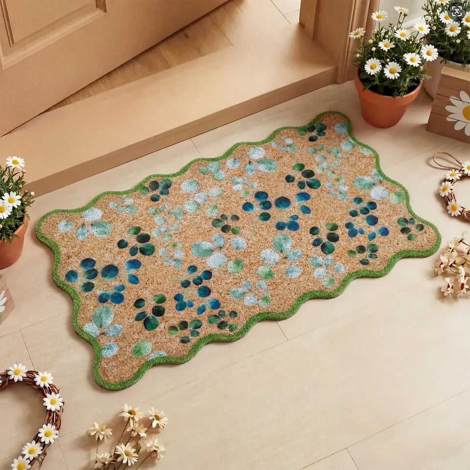 Dunzy eucalyptus leaves doormat with green scalloped edge welcomes guests and protects floors.