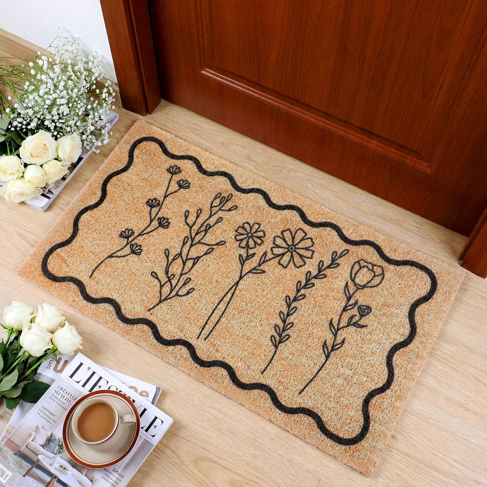 Dunzy floral welcome mat at the front door with a wildflower pattern that traps dust.