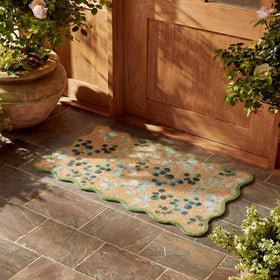 Dunzy spring decor doormat adds seasonal charm to porches.