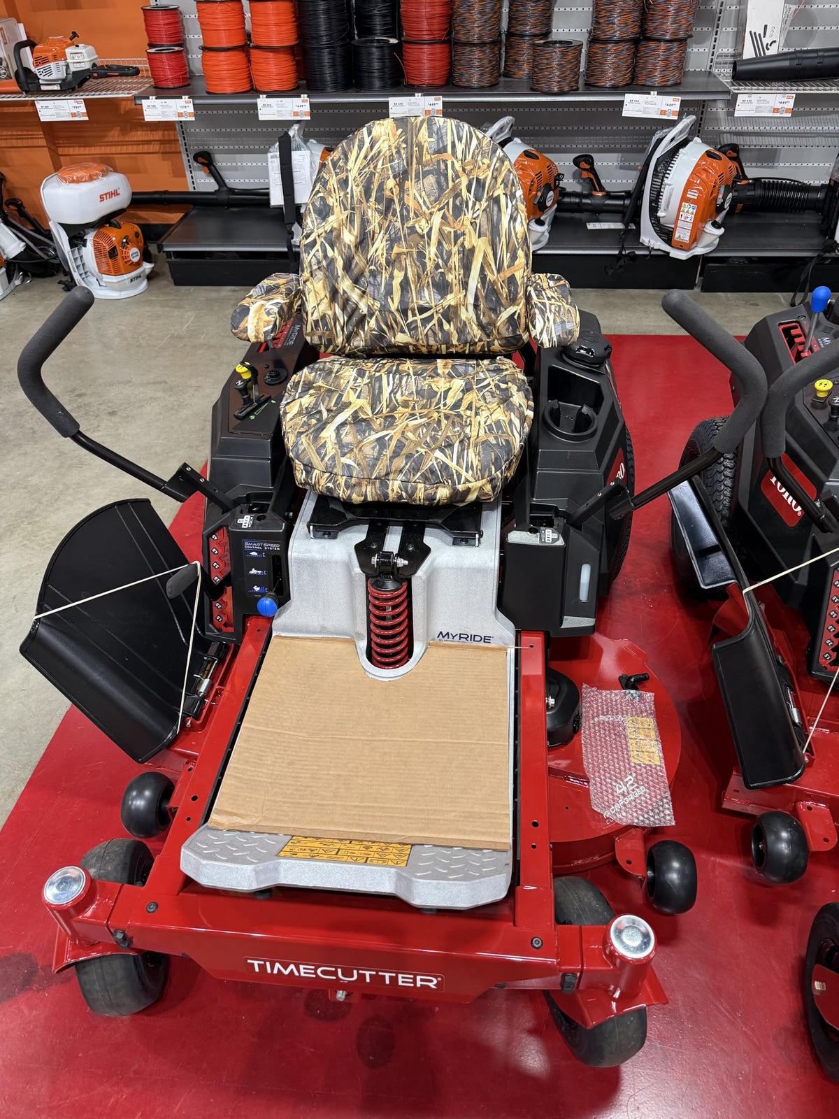 Durafit Savanna Camo Hustler Fastrack seat cover protects seats during long mowing sessions.