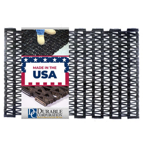 Durite tire-link mat with herringbone weave for durable outdoor entrances that drain water.