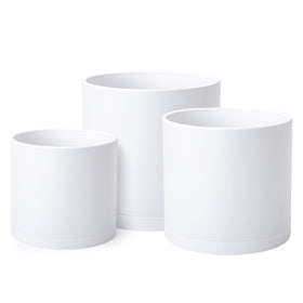 D'vine Dev 8-inch planter with drainage hole and seamless saucer, modern minimalist look.