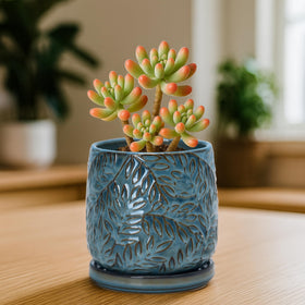 D'vine Dev embossed leaves planter, side view, showcasing modern texture and compact footprint.