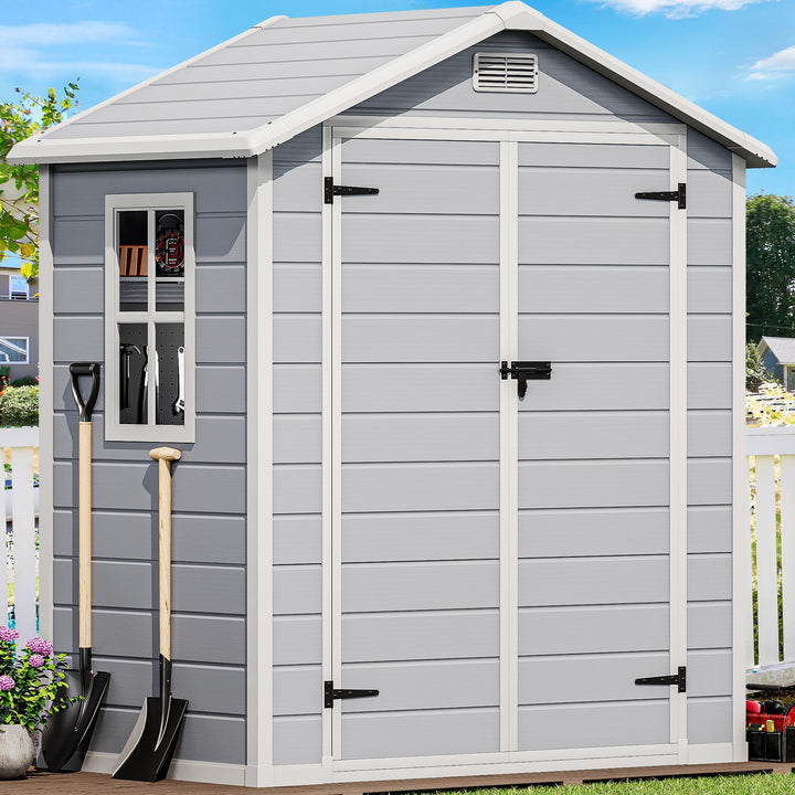 DWVO 6x4 ft resin storage shed exterior shows durable, weatherproof housing for garden tools.