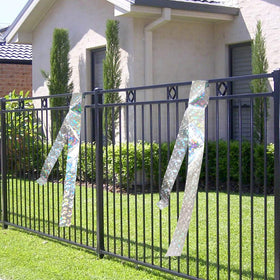 EACILLES ribbon wrapped around fruit trees creates a shimmering deterrent