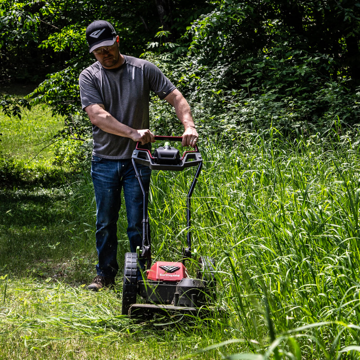 Earthquake 60V mower 14-inch airless wheels glide over uneven terrain.