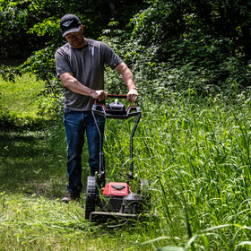 Earthquake 60V mower 14-inch airless wheels glide over uneven terrain.