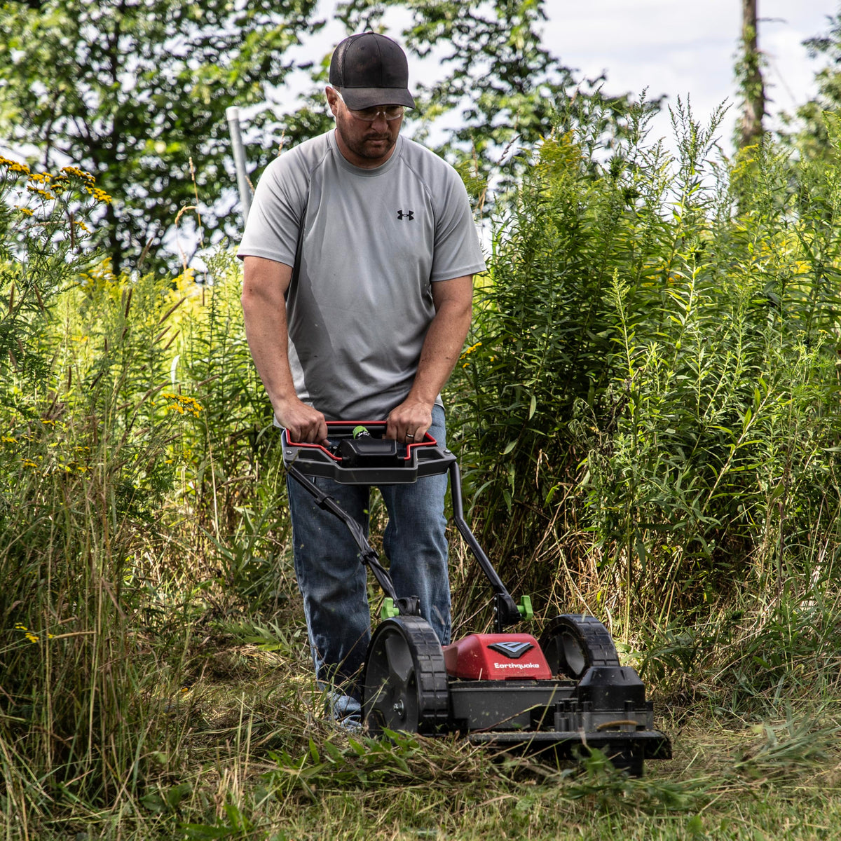 Earthquake 60V mower with 22-inch cutting head for wide, efficient mowing.